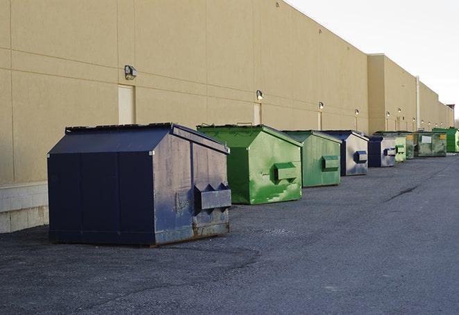 a row of construction dumpsters parked on a jobsite in Lima